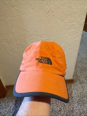 The North Face Orange Men's Trail Hat with Black Logo